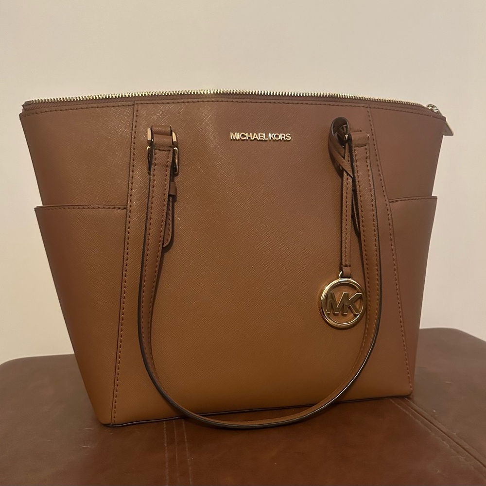 Michael Kors Charlotte top zip tote with gold hardware. Color is Luggage